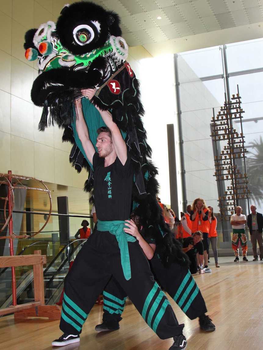 Shan Watts performing traditional Lion Dancing.