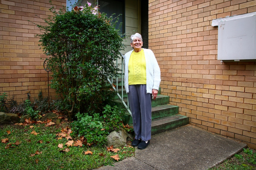 June Brown out the front of her public housing residence of 35 years.