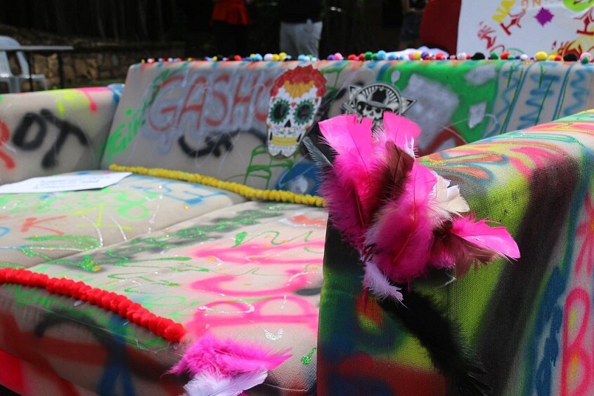 A couch is scrawled with messages for Darwin's 7th annual couch surfing race