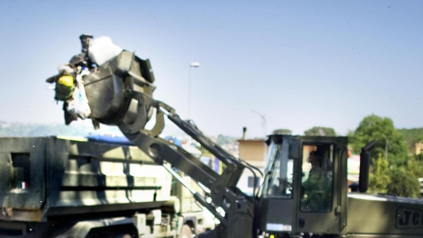 Soldiers from the Italian army collect garbage in Naples