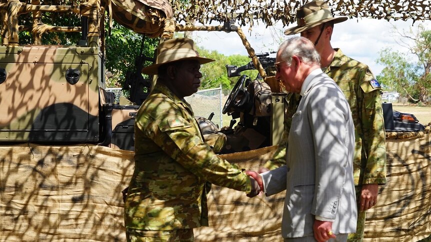 Sergeant Norman Daymirringu and Prince Charles shake hands