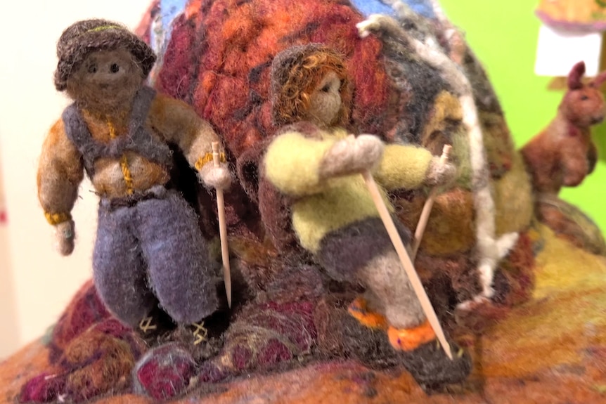 Ms Van der Gaag and her husband depicted in felt on her beanie