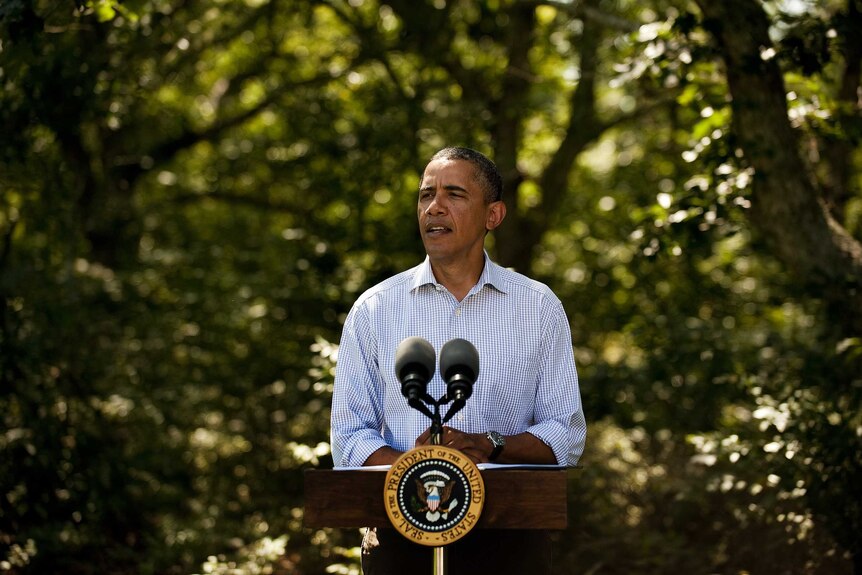 US President Barack Obama gives an address outdoors in America.