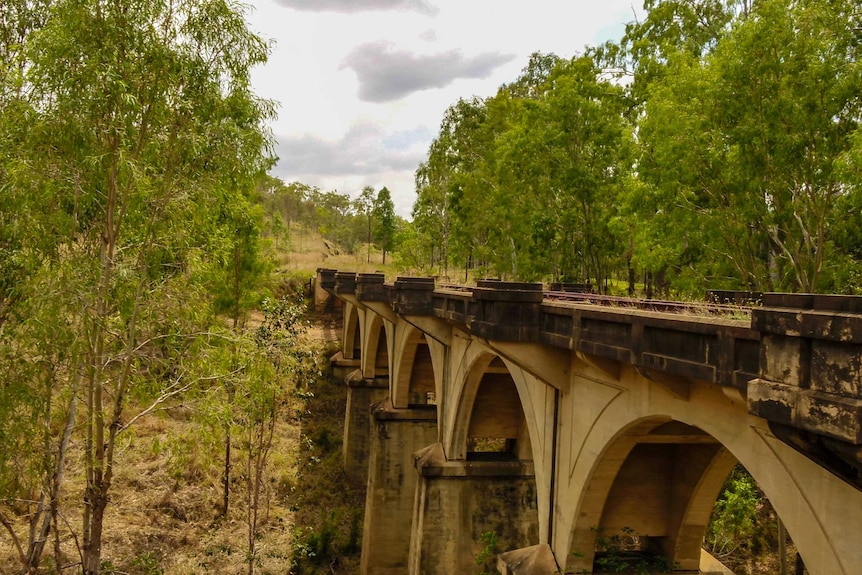 Concrete arched railway bridge not in use.