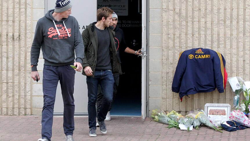 Crows players and Phil Walsh memorial