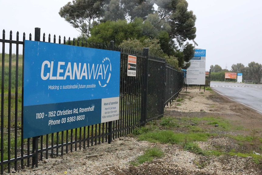 A blue sign with the words "Cleanaway: Making a sustainable future possible" sits at the entrance to the Ravenhall tip.