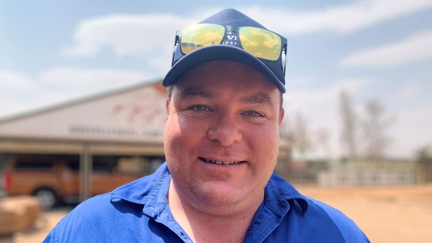 Ben Fullager stands outside in Birdsville where the temperature hit 49.3C that day.