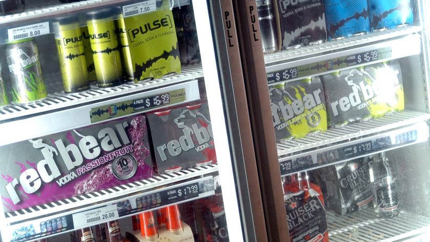 Drinks sit in a bottle shop fridge