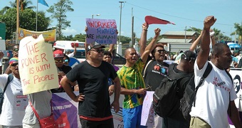 Protesters chant in support of Fiji's airport workers.