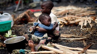 A Congolese boy holds his brother (Getty Images: Uriel Sinai)