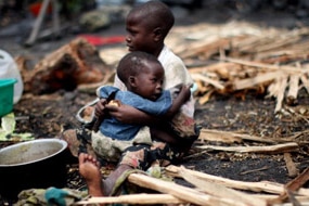 A Congolese boy holds his brother (Getty Images: Uriel Sinai)