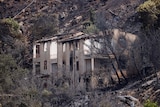 A house burnt by wildfire in the Sicilian village of Romitello