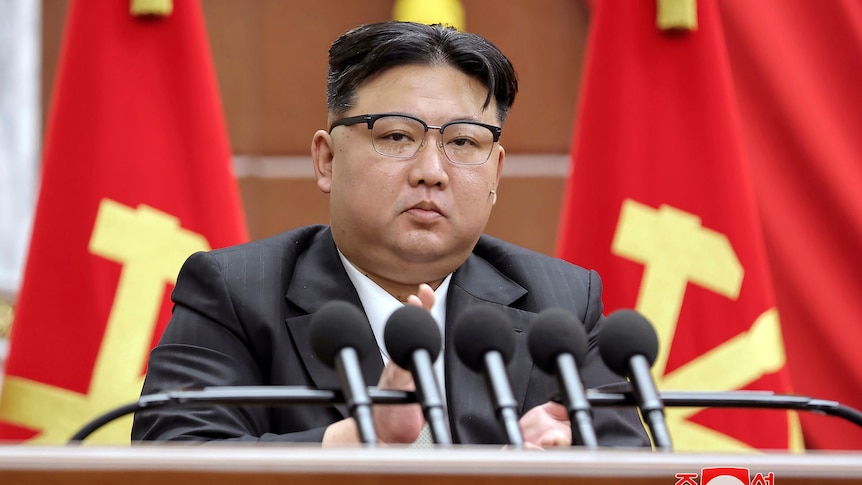 A close up of North Korean leader Kim Jong Un giving a speech.