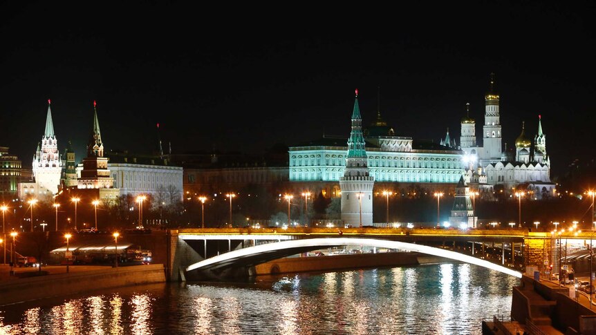 A combination photo shows the Kremlin during Earth Hour (bottom) and after the lights were switched on.