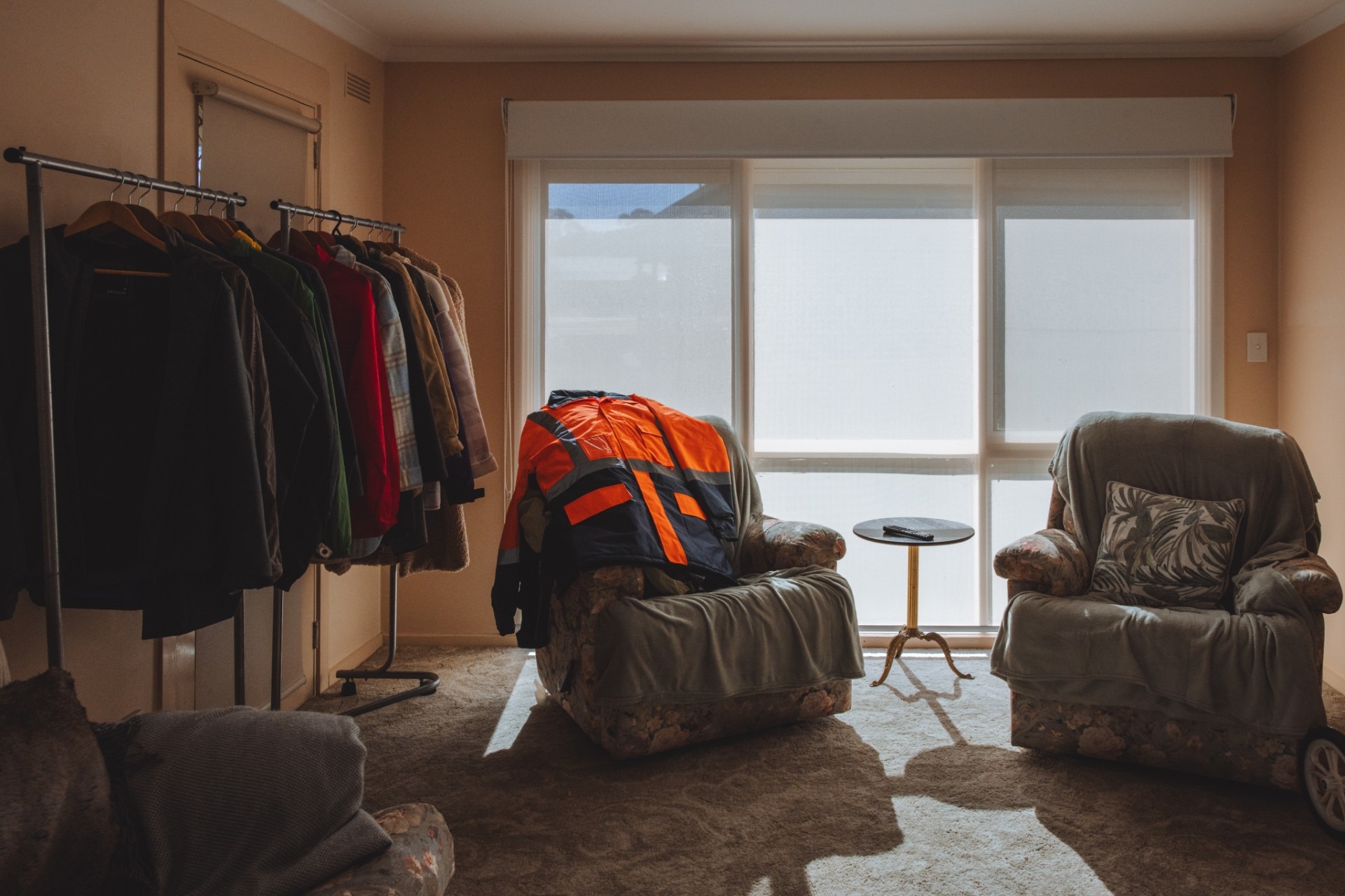 drop in centre lounge with clothes and couches.