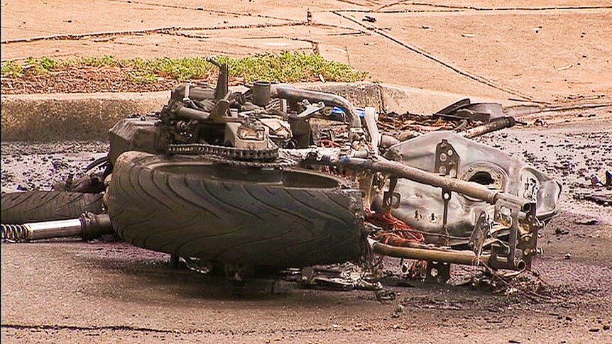 A damaged motorcycle on the road