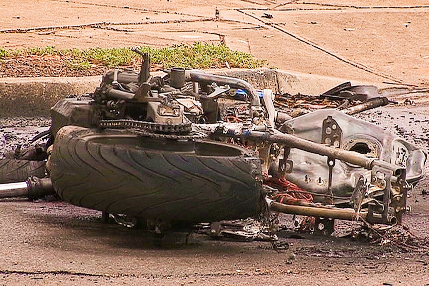 A damaged motorcycle on the road