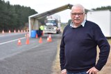 Regional mayor Richard Sage stands at a border checkpoint near Mount Gambier