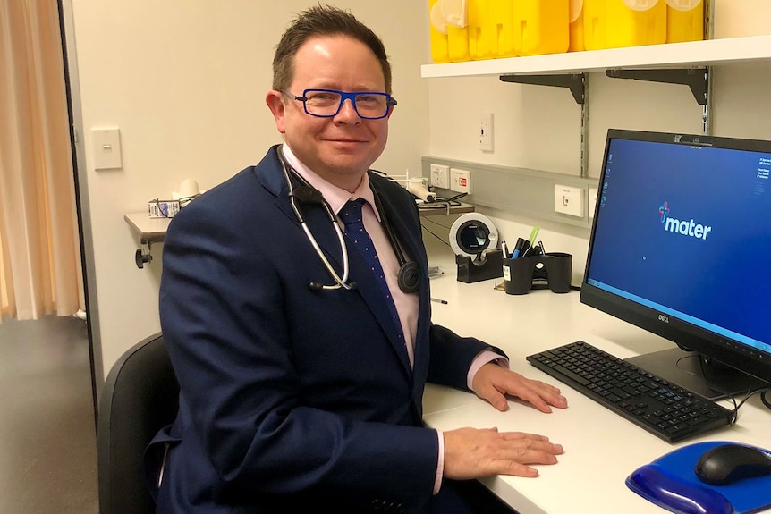 Dr Paul Griffin sits in an office at the Mater Hospital in Brisbane