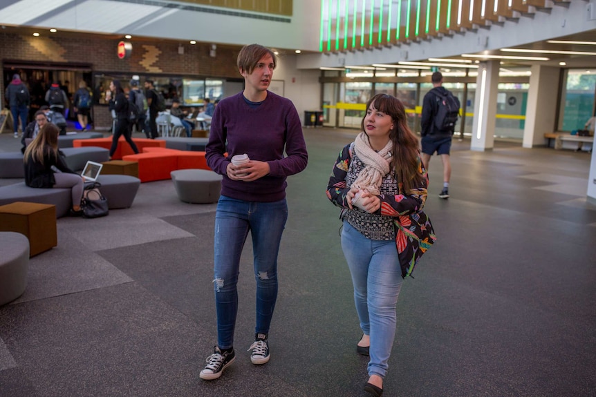 Shannon Colee walks with a friend on the Deakin University campus.