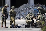 The body of a Palestinian who stabbed an Israeli soldier is seen on the ground