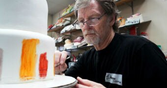 Baker Jack Phillips decorates a cake in his Masterpiece Cakeshop in Lakewood, Colorado