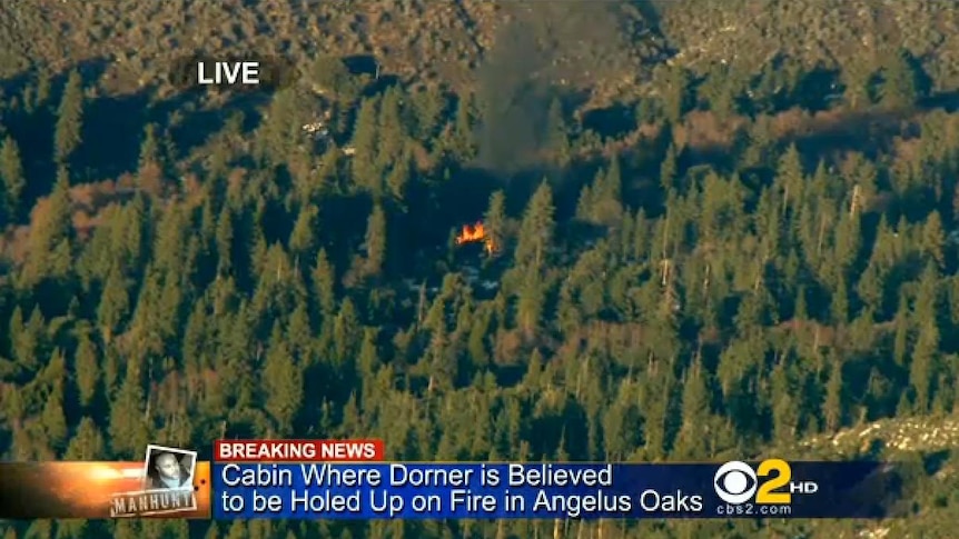 Smoke rises from Dorner cabin