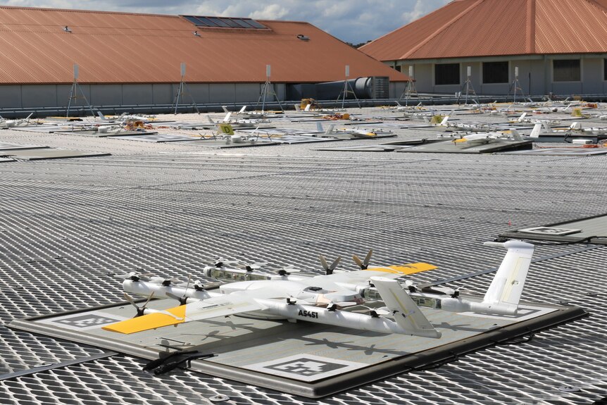 A Wing drone waits for the next order on the rooftop of a Browns Plains shopping centre.
