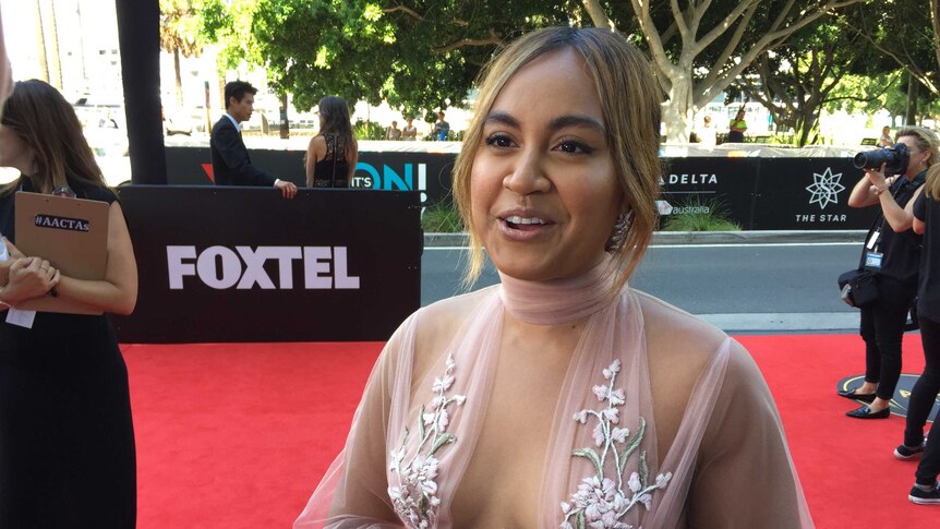 Jessica Mauboy wears a pale pink lace dress at the AACTA Awards.