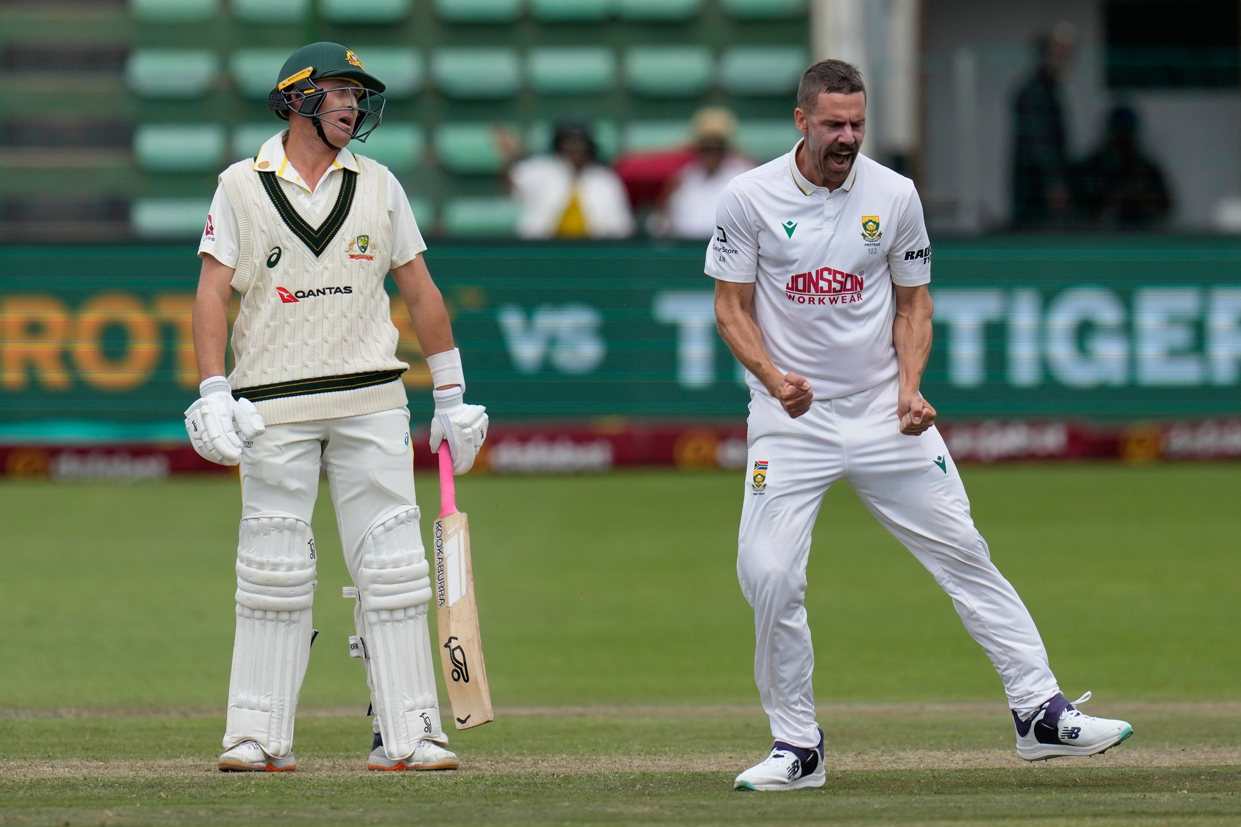 Bowler pumps fists after taking wicket, batter throws head back in disappointment