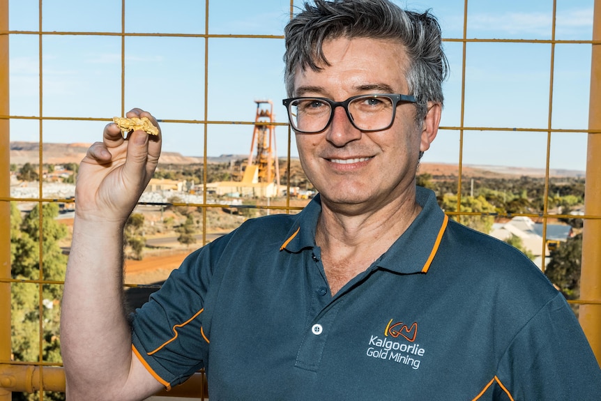 A geologist holding a gold nugget in the gold mining city of Kalgoorlie-Boulder.  