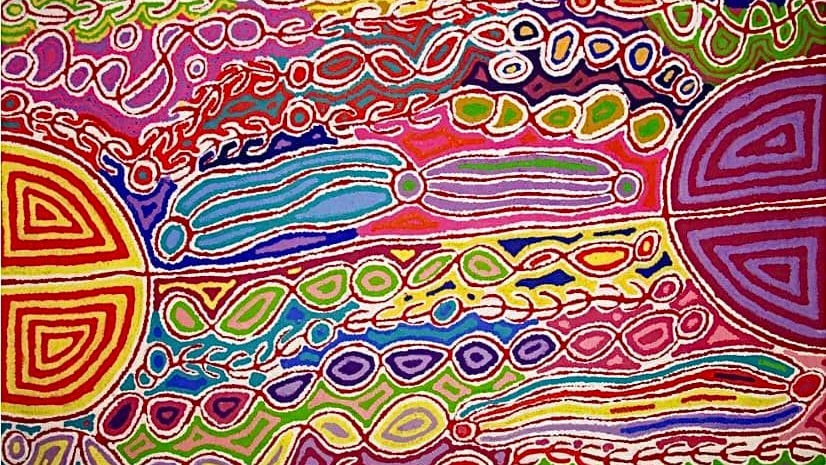 A brightly coloured Indigenous dot painting in pinks, blues, yellows and purples.