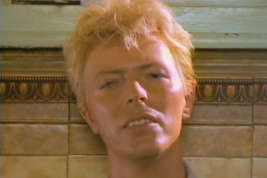 David Bowie sings to camera