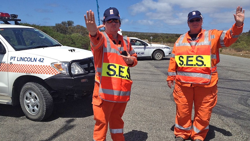 SES workers stop traffic from heading into the danger zone