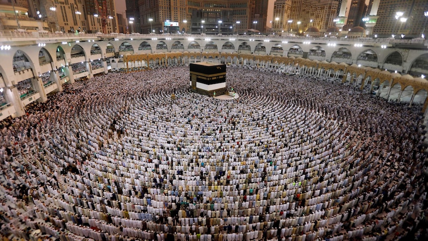 A wide view of lines of Muslims praying at the Grand mosque in Mecca.