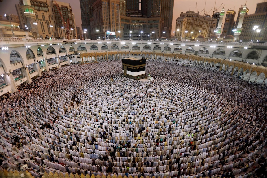 A wide view of lines of Muslims praying at the Grand mosque in Mecca.