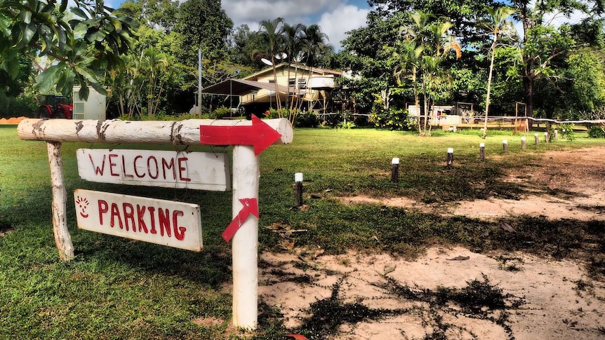 Campground with Welcome and Parking sign