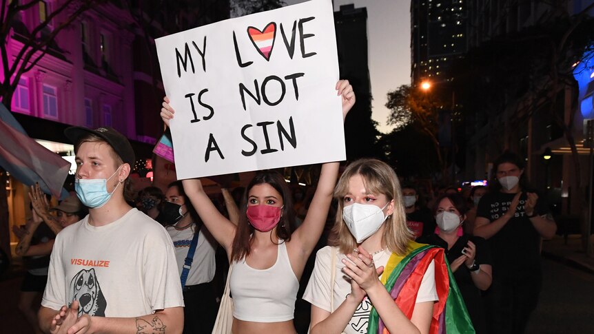 Anti-discrimination protesters marching through the Brisbane CBD