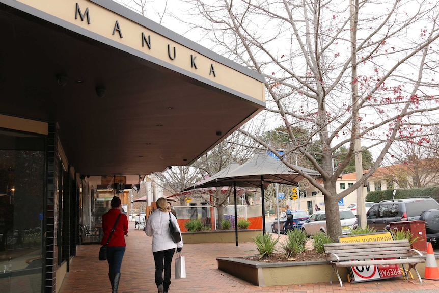 Shoppers walk around the Manuka precinct.