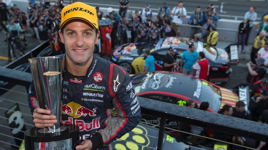 Jamie Whincup with the V8 Supercars trophy after the final round at Homebush.