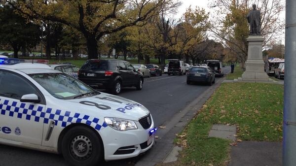 Police car near Botanic Gardens where body of a woman found