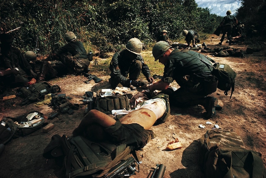 Medics move in to triage military casualties during the Vietnam War