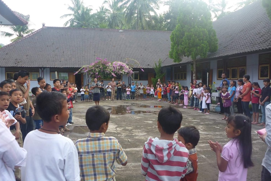 Indonesian students stand outside their school in Bali.