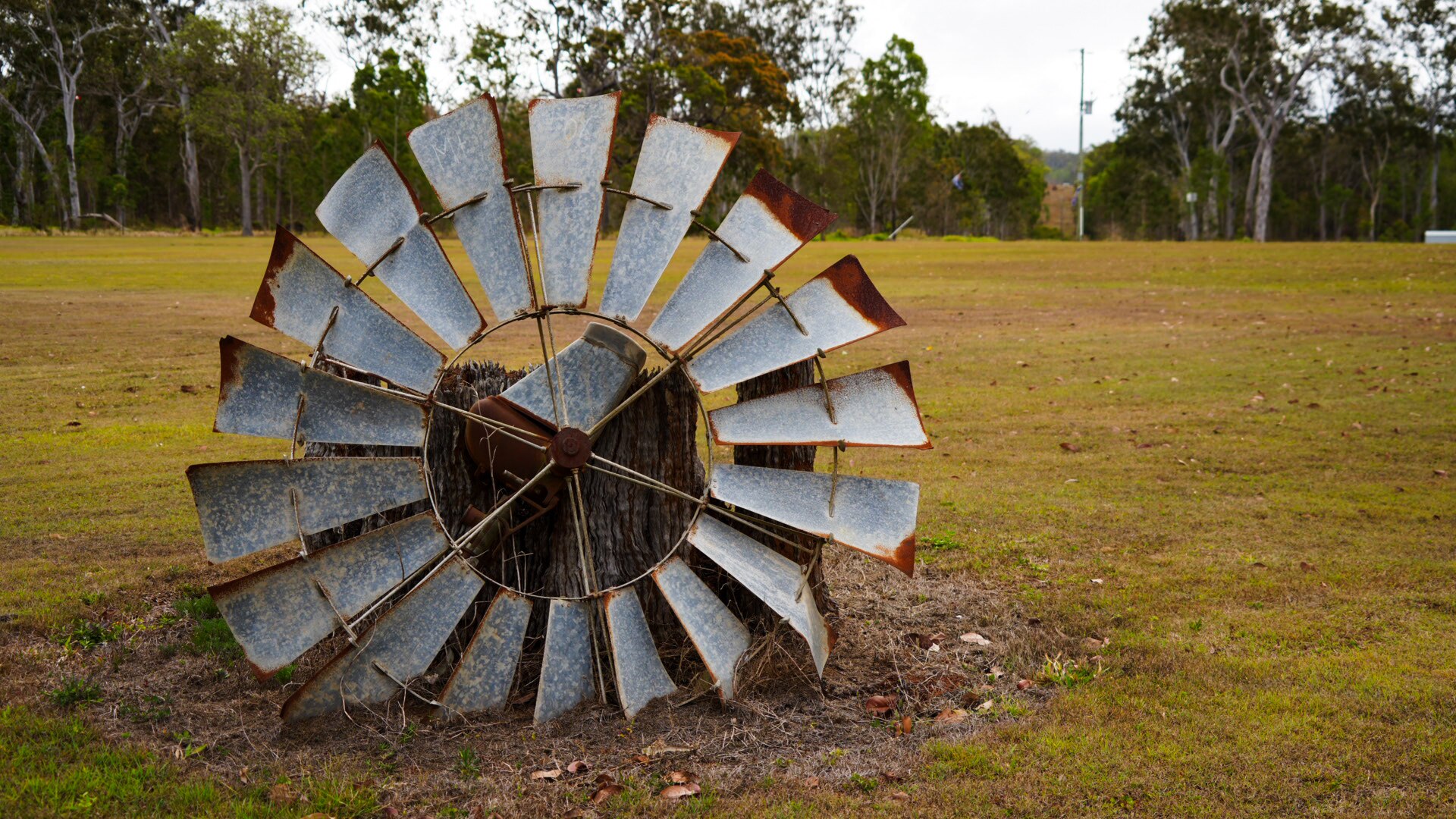 A broken windmill at Mount Fox lying on the ground.