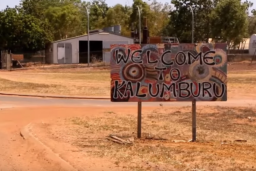 A colourful welcome sign at the entrance to Kalumburu Aboriginal mission.