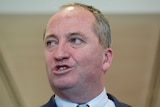 A close-up of Barnaby Joyce speaking, his mouth mid-word
