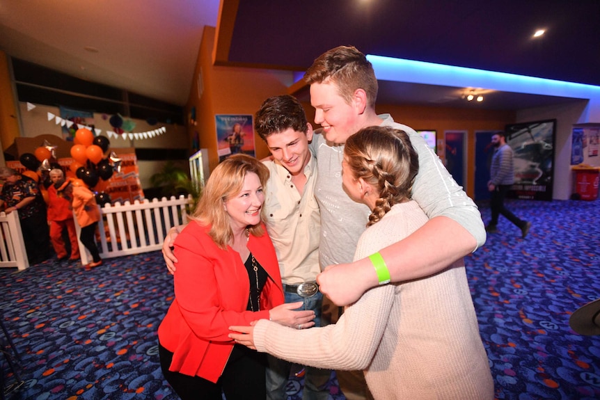 Rebekha Sharkie hugs her children.