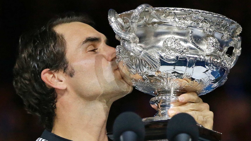 Federer kisses the trophy