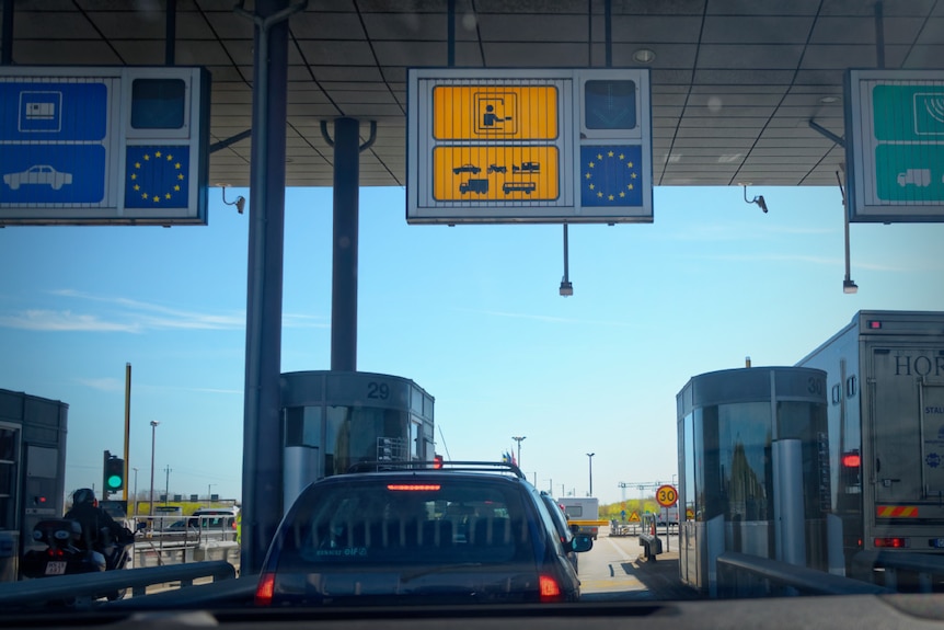 A car waits at border control as it enters Sweden on the Oresund Bridge.