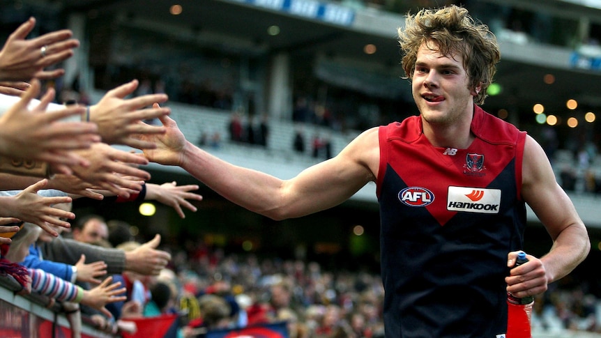 Melbourne's Jack Watts celebrates a victory with fans.